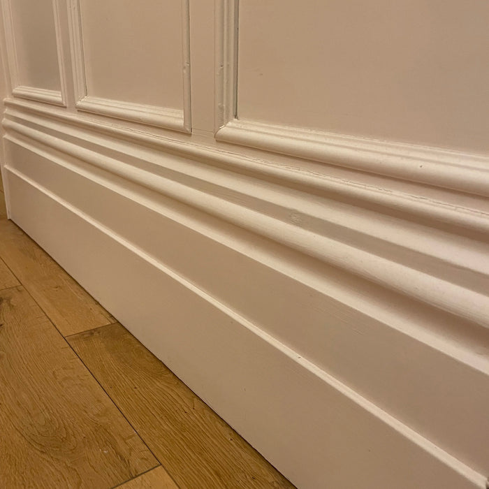 10 inch skirting board with painted shaker style panelling above with inset timber mouldings