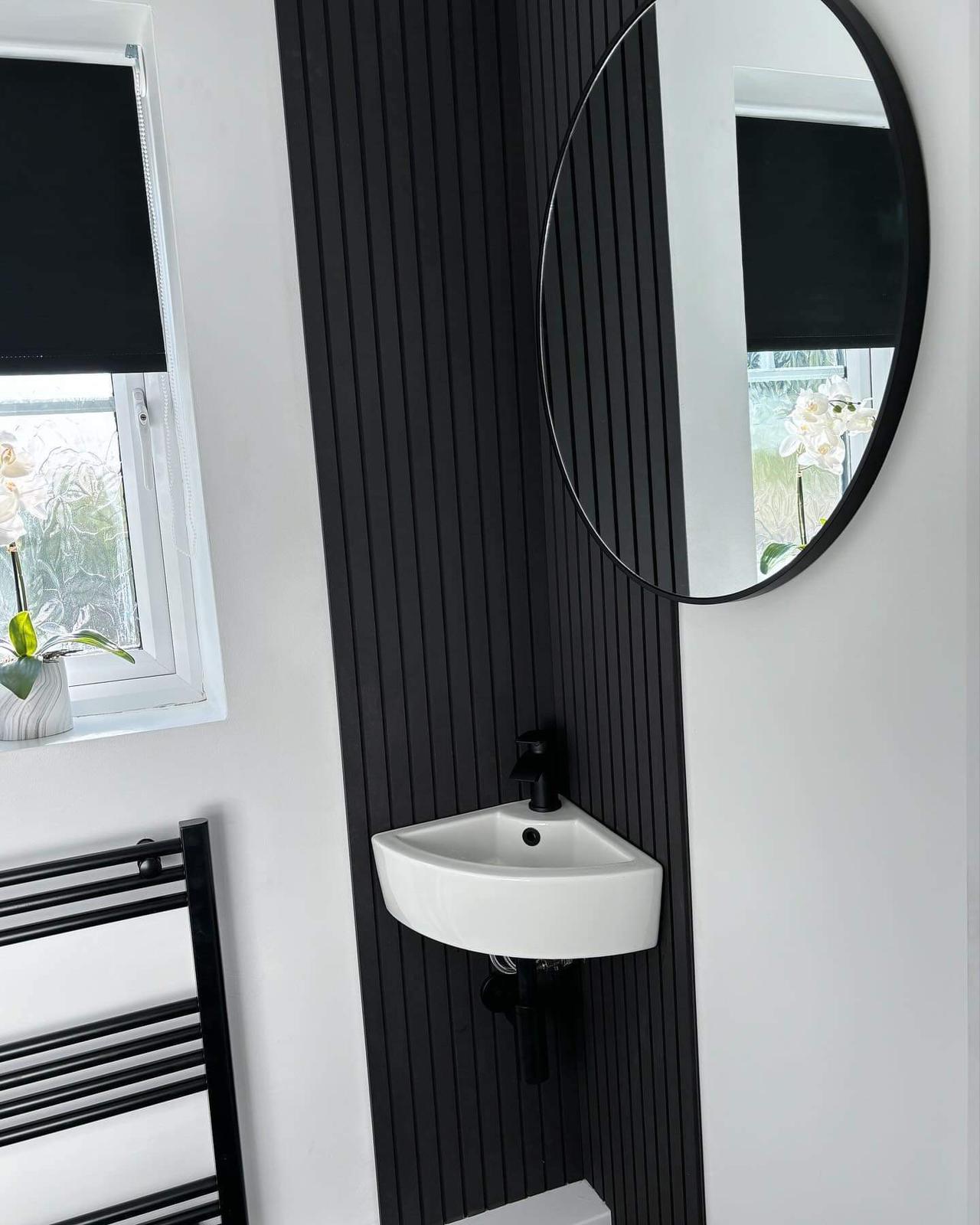 Black Slatwall panel in a downstairs bathroom 